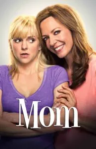 A poster of two women posing for the movie mom.