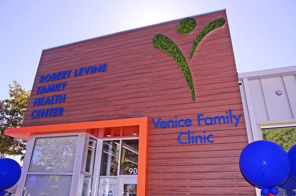 A building with the words venice family clinic on it.